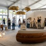 Elegant collectible furniture and lighting objects on display at Design Miami 2026 fair in Miami Beach
