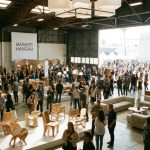 Visitors exploring contemporary furniture exhibits at WestEdge Design Fair 2026 inside Barker Hangar, Santa Monica