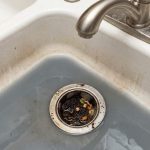 Cleaning a kitchen sink drain to remove unpleasant odors