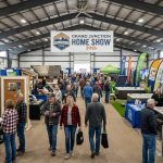 Visitors exploring home improvement vendor booths at the Grand Junction Home Show 2026 inside the Mesa County Fairgrounds